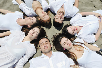 Image showing Group of happy young people in have fun at beach