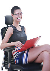 Image showing brunette female  model posing on business chair