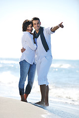 Image showing happy young couple have fun at beautiful beach