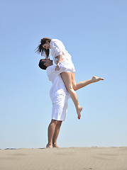 Image showing happy young couple have fun on beach