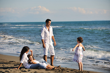 Image showing happy young  family have fun on beach