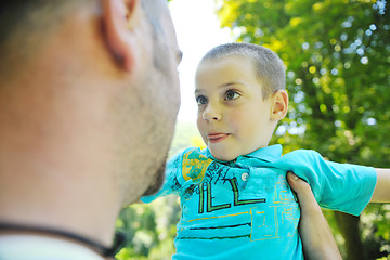 Image showing happy father and son have fun at park