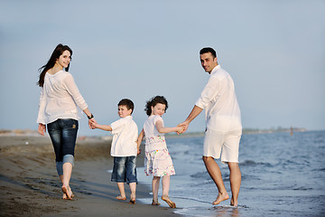 Image showing happy young family have fun on beach