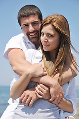 Image showing happy young couple have fun on beach