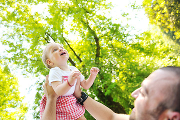 Image showing man and baby playing in park