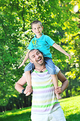 Image showing happy father and son have fun at park