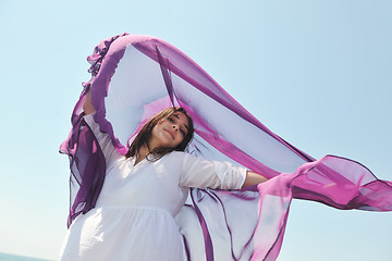 Image showing beautiful young woman on beach with scarf