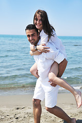 Image showing happy young couple have fun on beach