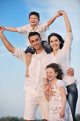 Image showing happy young family have fun on beach