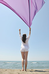 Image showing beautiful young woman on beach with scarf