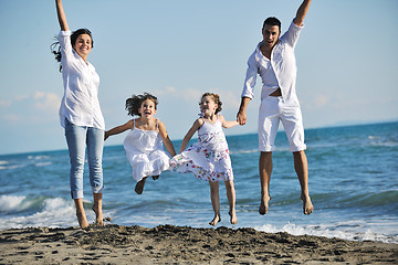 Image showing happy young  family have fun on beach