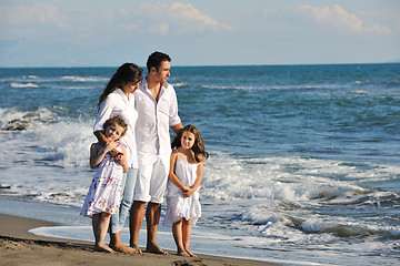 Image showing happy young  family have fun on beach