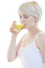 Image showing Young woman squeeze orange juice