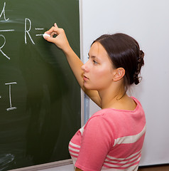 Image showing Beautiful girl in a physics class