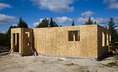 Image showing Building a house of wood blocks