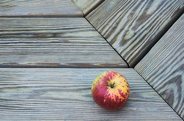 Image showing Apple On A Wooden Bench