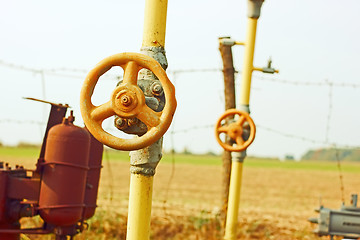 Image showing Natural gas station among fields