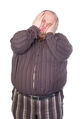 Image showing Obese man squashing his face