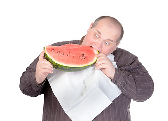 Image showing Fat man tucking into watermelon