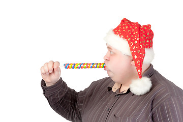 Image showing Cheerful fat man in Santa hat