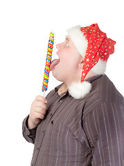 Image showing Cheerful fat man in Santa hat