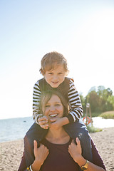 Image showing Mother and son at beach.