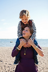 Image showing Mother and son at beach.