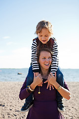 Image showing Mother and son at beach.