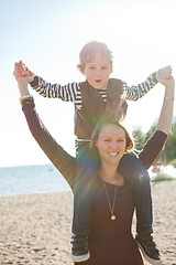 Image showing Mother and son at beach.