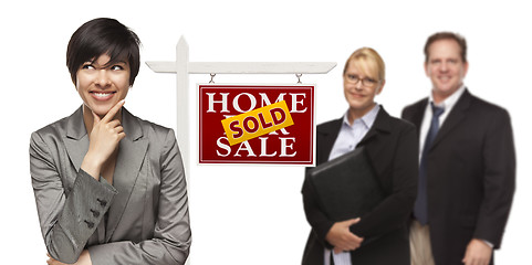 Image showing Mixed Race People with Sold Real Estate Sign Isolated