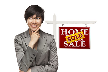 Image showing Woman and Sold Home For Sale Real Estate Sign Isolated