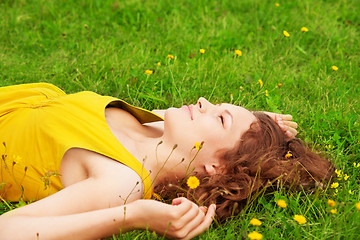 Image showing girl relaxing on the grass