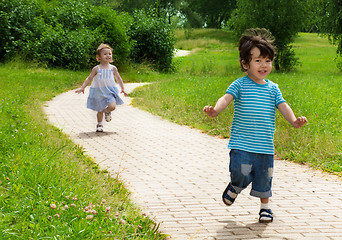 Image showing girl chasing cute boy