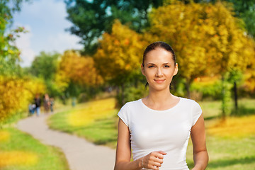 Image showing pretty confident woman jogging