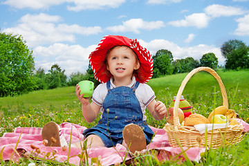 Image showing funny little girl holding cup