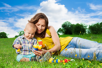 Image showing mother playing with son in park