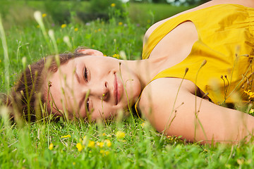 Image showing girl laying on green grass