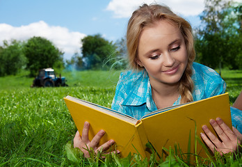 Image showing country girl reading a book