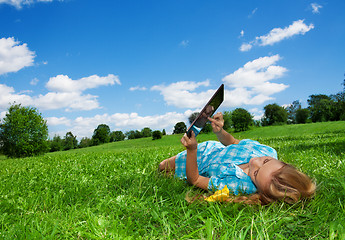 Image showing student enjoying internet  in park