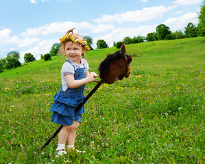 Image showing happy girl with horse stick