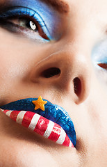 Image showing girl with american flag on lips