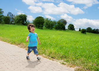 Image showing little boy running in park