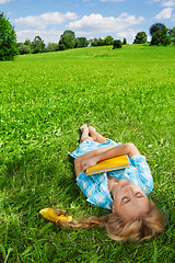 Image showing beautiful girl sleeping on lawn