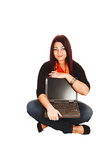 Image showing Woman holding laptop.