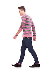 Image showing side view of a fashion man walking