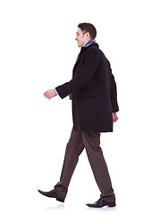 Image showing young business man walking forward 
