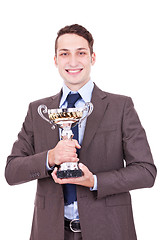 Image showing winning businessman holding his award