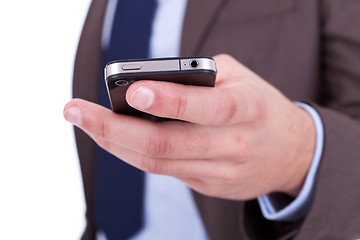 Image showing Flat cell phone in businessman hand