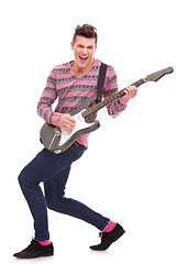 Image showing passionate guitarist playing an electric guitar