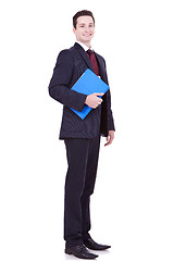 Image showing young business man with a blue clipboard